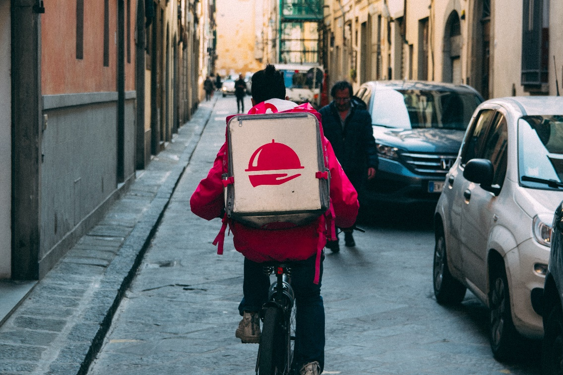  Delivery person on a bicycle.