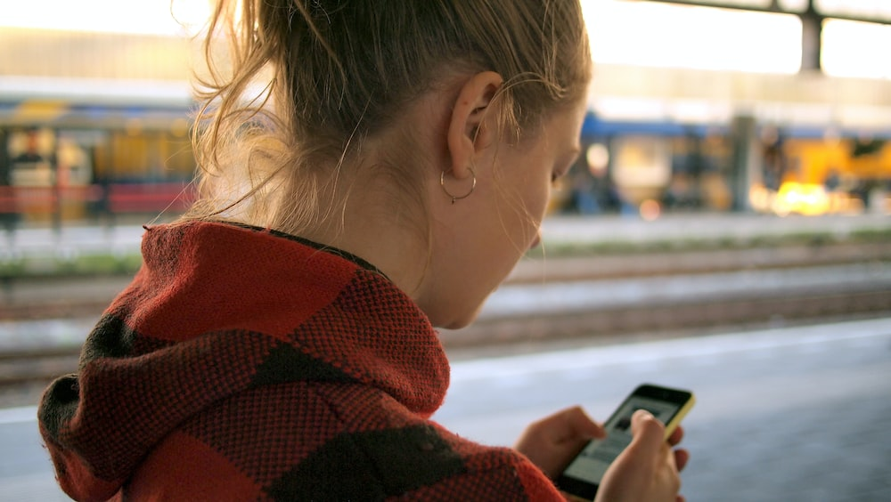 a woman using her phone. 